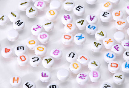 Small 4x7mm Round White w/Pastel Print Alphabet Beads (250 pc) - Dolls so Real Inc